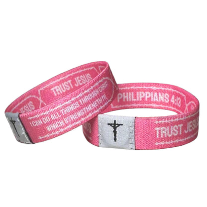Pink Christian Daily Bible Verse Wristbands with Philippians 4:13 on it.