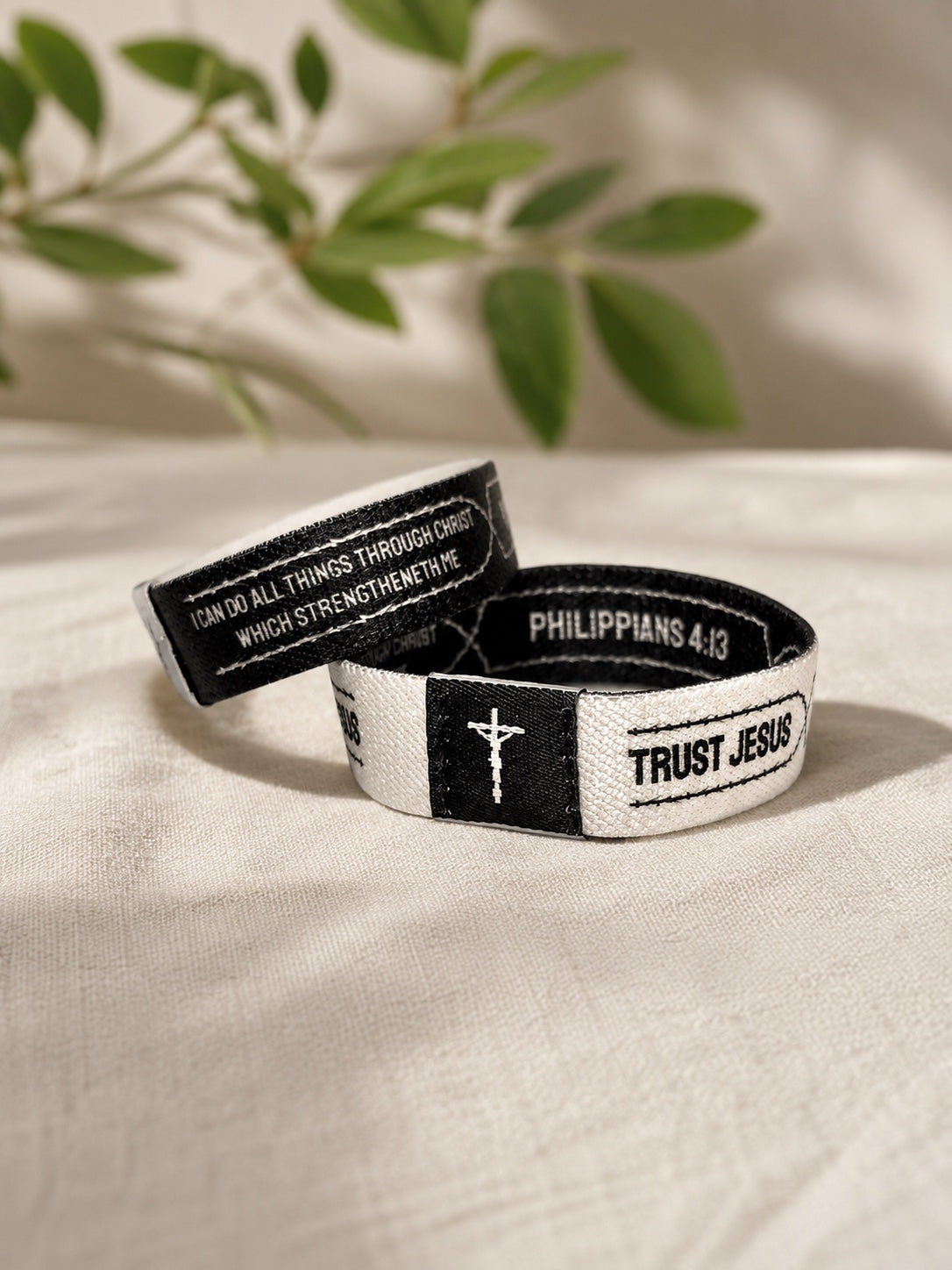 White and black Trust Jesus Christian wristband featuring Philippians 4:13